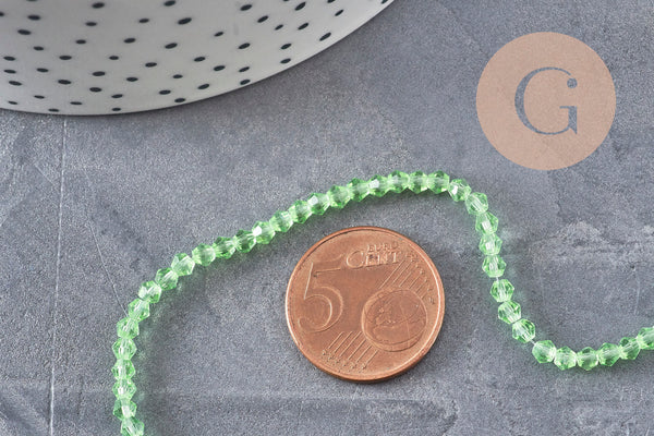 Perles cristal toupies à facette vert transparent 3-3.3mm, x1 fil de 38cm (G11111)