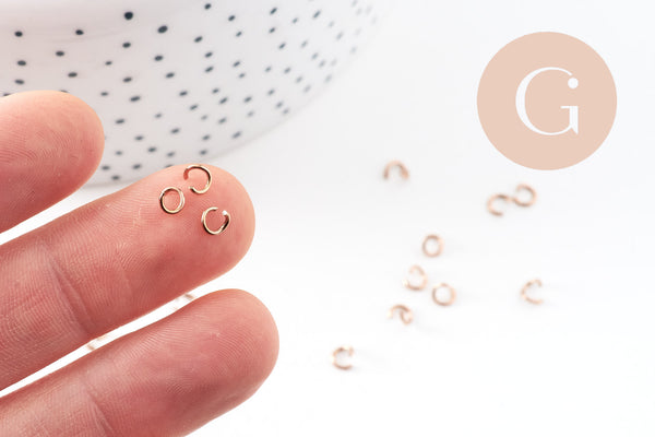 Anneaux ronds acier 304 inoxydable or rose PVD 4mm x0.7mm, x 50 (G10907)
