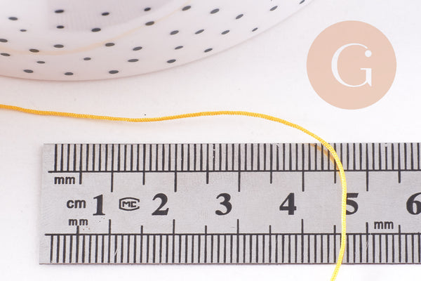 Cordon Jaune doré tressé polyester 0.6mm, x1 mètre (G10664)
