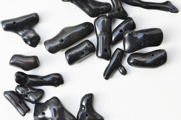 EP Perle branche corail noir percée naturel 15-25mm,x 10 G4073