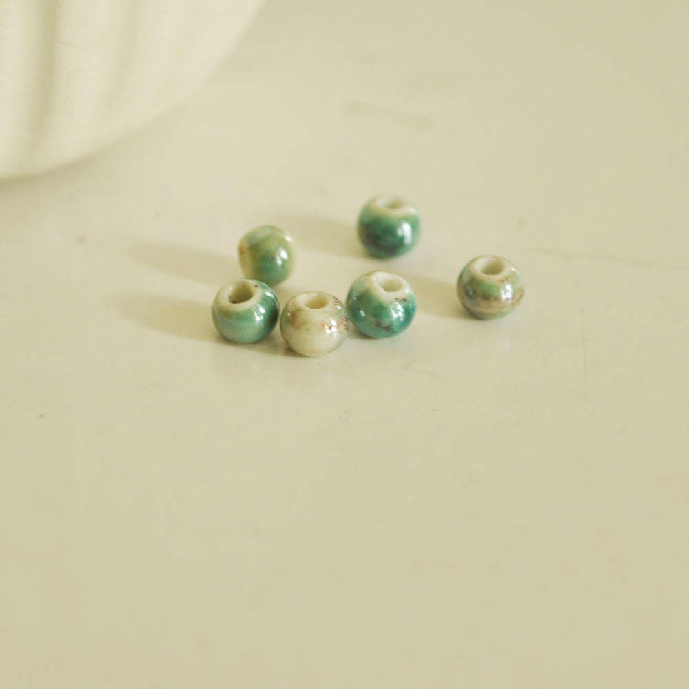EP -perle porcelaine vert irisé 7mm, x5 (G2106)