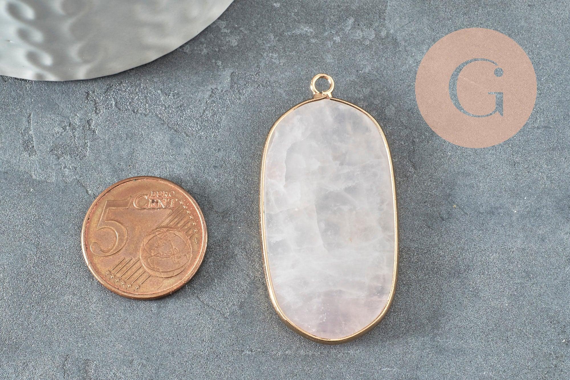 Rose quartz hexagon pendant, 49mm, next to a 5 euro-cent coin on a textured surface; part of a chic bohemian jewelry collection.