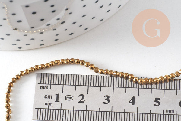 Perle ronde facetté hématite dorée 2mm, x1 fil 39.8cm (G4428)