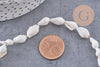 Perles coquillage naturel percés blanc, x1 fil de 135 (G7987)