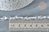 Clear quartz beads, 4–7mm, laid next to a ruler for scale, with a polka-dotted dish edge visible; 40cm strand for jewelry making.