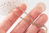 Perles cristal toupies facette beige transparent 3mm,fil de 36cm, x1 (G2598)