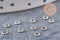 Perles intercalaires rondelles fleurs acier 304 inoxydable platine 3mm, x10 (G10855)
