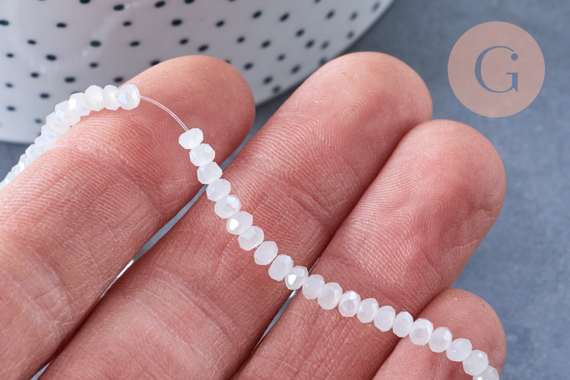 Perles toupies cristal blanc irisé 3.5x2.5mm, fil 25.4cm x1 (G6763)