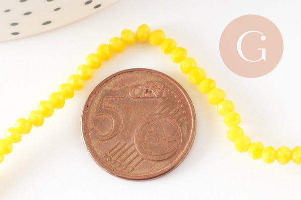 Perles toupies verre jaune facette 3mm, x1 fil de 38cm (G2669)