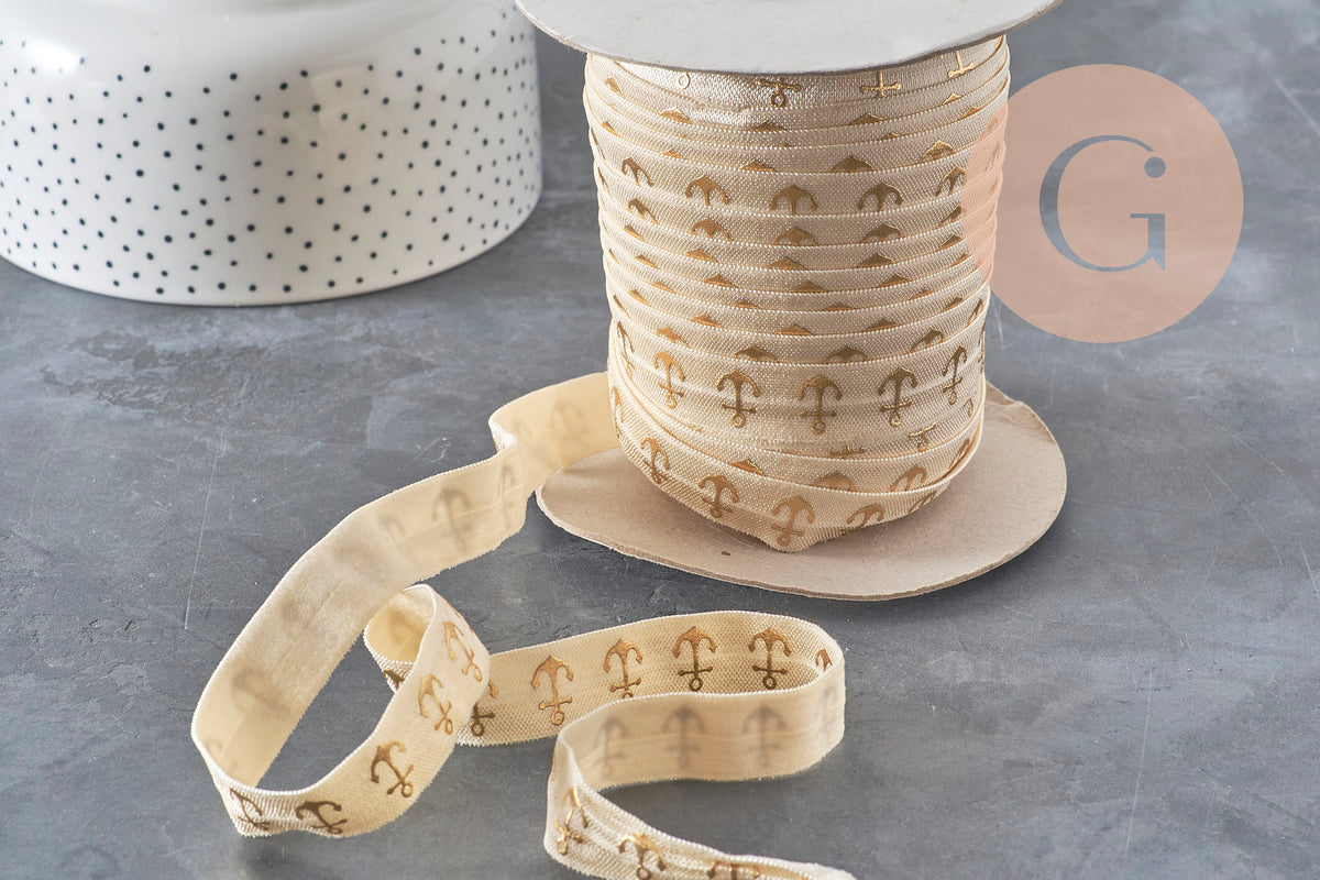 Bobine de ruban élastique écru de 16mm avec motif d'ancres dorées pour bijoux DIY.