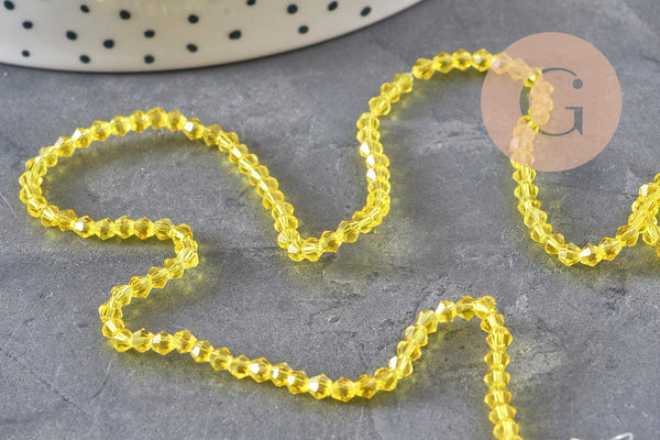 Perles cristal toupies à facette jaune transparent 3-3.3mm, x1 fil de 38cm (G11110)