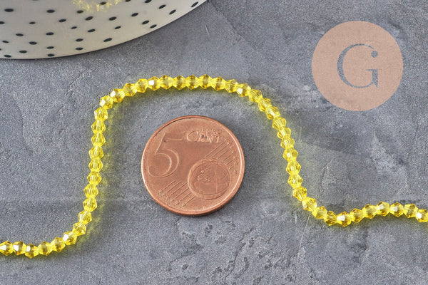 Perles cristal toupies à facette jaune transparent 3-3.3mm, x1 fil de 38cm (G11110)