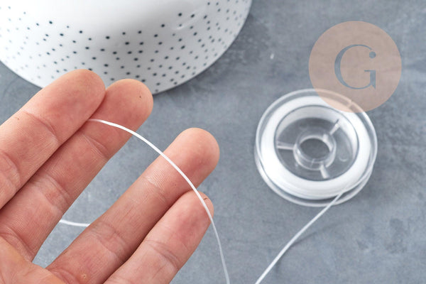 Bobine de 10 mètres de fil élastique nylon blanc 0.8mm, x1 (G8914)