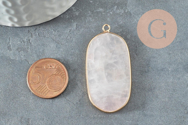Rose quartz hexagon pendant, 49mm, next to a 5 euro-cent coin on a textured surface; part of a chic bohemian jewelry collection.
