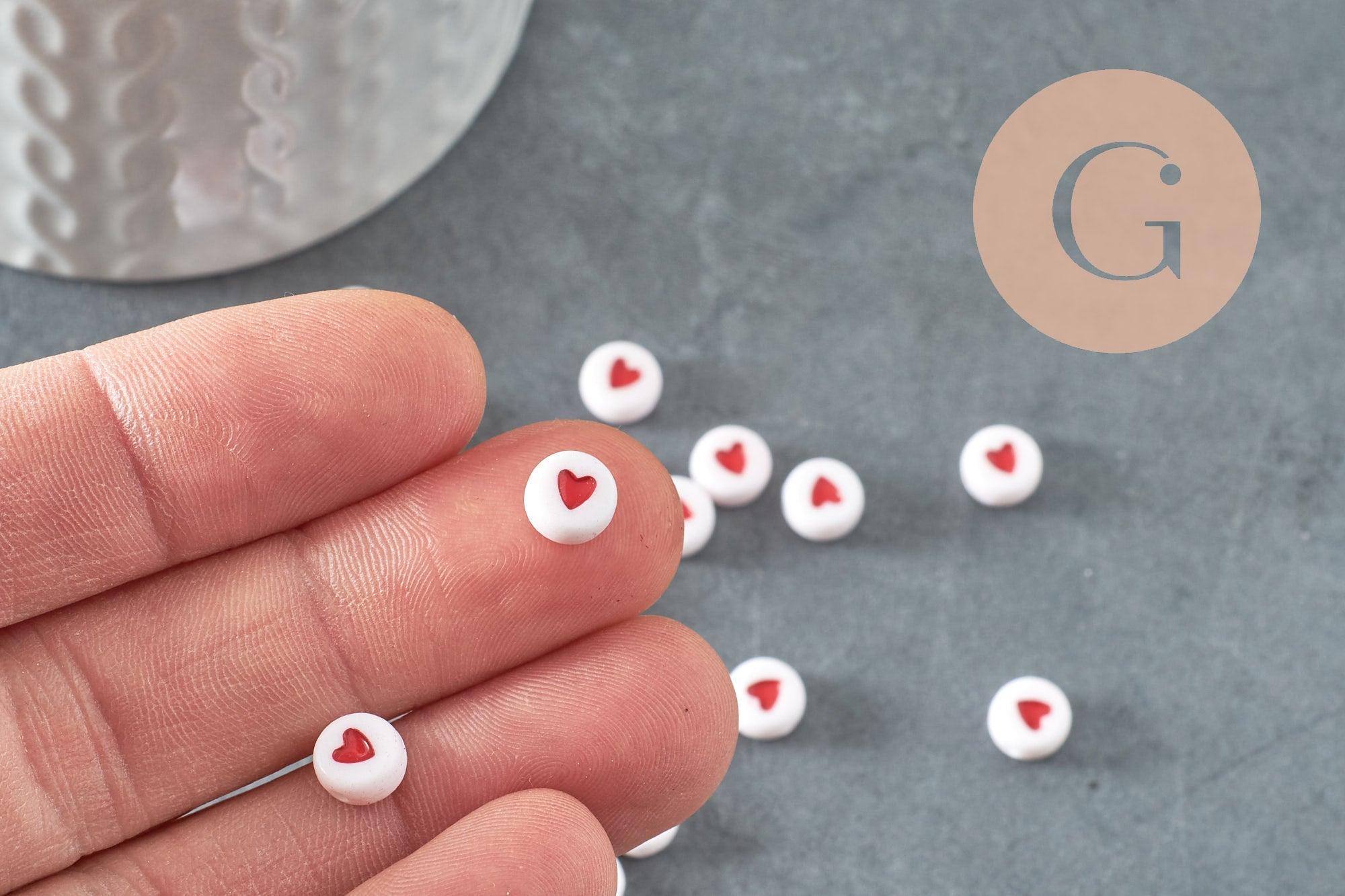 Perle disque coeur rouge plastique blanc 7mm, x10 grammes (G1786)