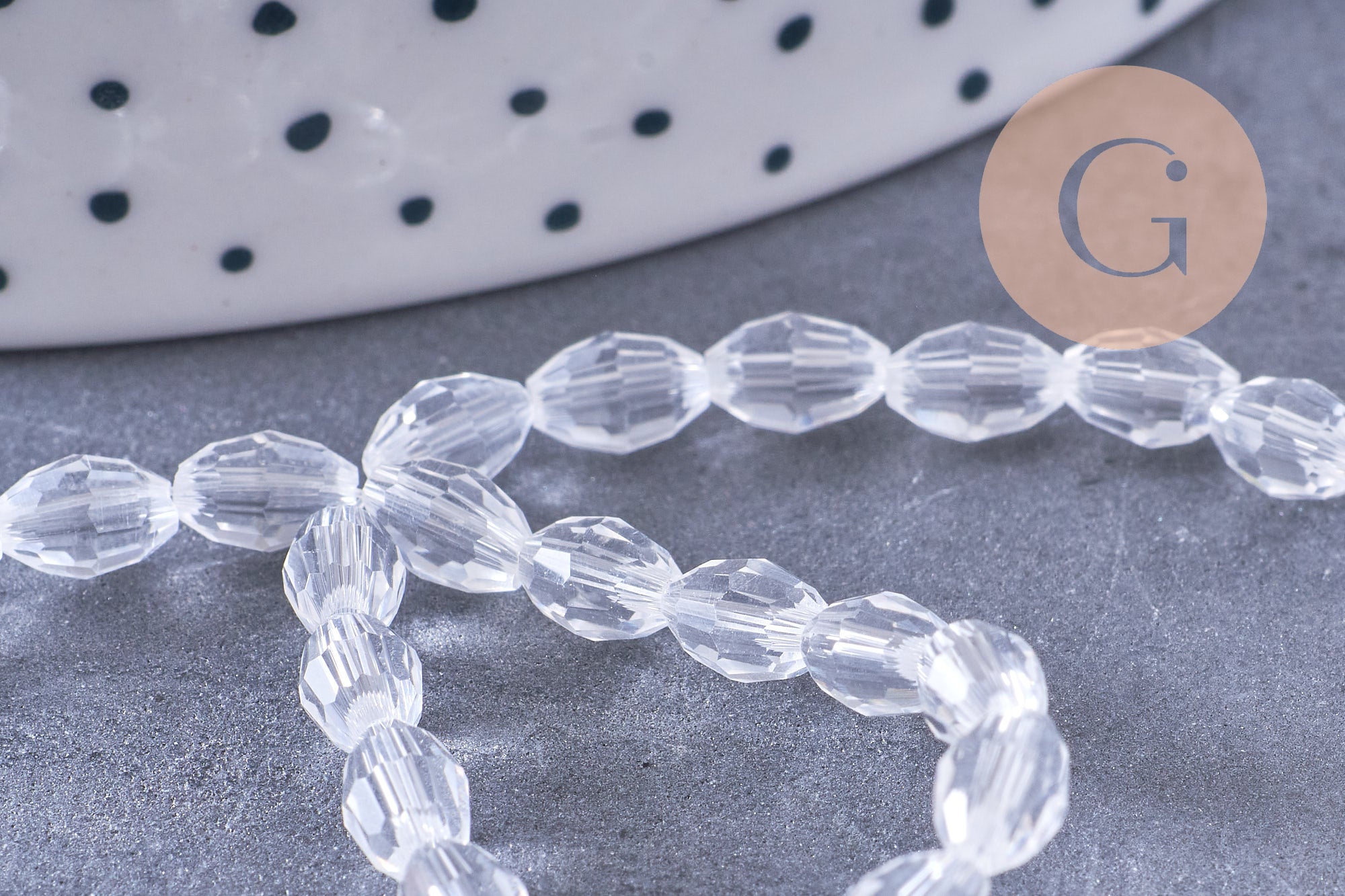 Perle ovale verre facetté transparent 6x4mm, x1 fil de 38cm (G10584)