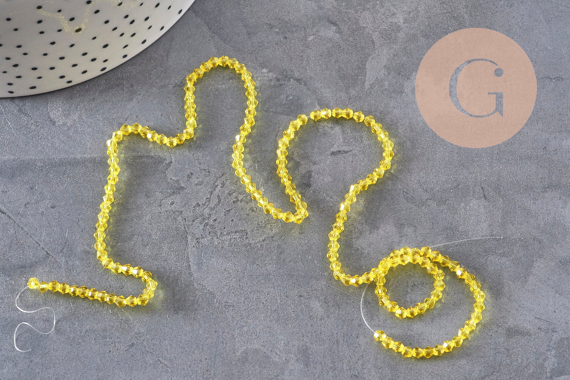 Perles cristal toupies à facette jaune transparent 3-3.3mm, x1 fil de 38cm (G11110)