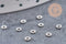 Perles intercalaires Rondelles fleurs acier 304 inoxydable platine 3mm, x10 (G10856)