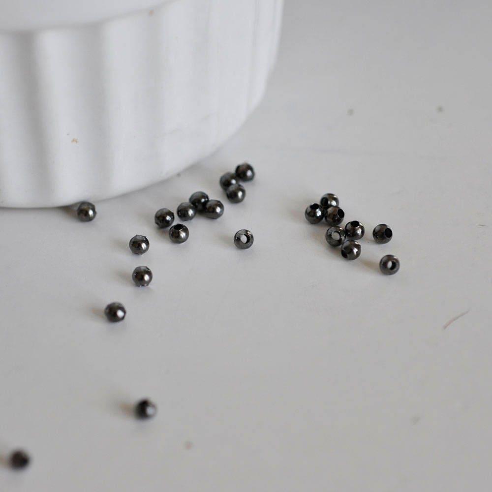 Perles intercalaires noires métalgun 3mm, x10 grammes (G2441)