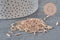 Cuentas de rocalla en tubo rosa champán metalizado 6-8mm x 1.6mm, x10gr (G2459)