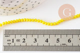 Perles rondelles verre jaune opaque facette 3x2mm, x1 fil de 32cm (G8256)