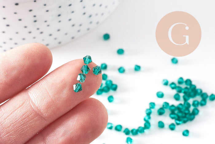 Perles toupie bicone cristal autrichien facette vert 4mm, x20 (G10514)