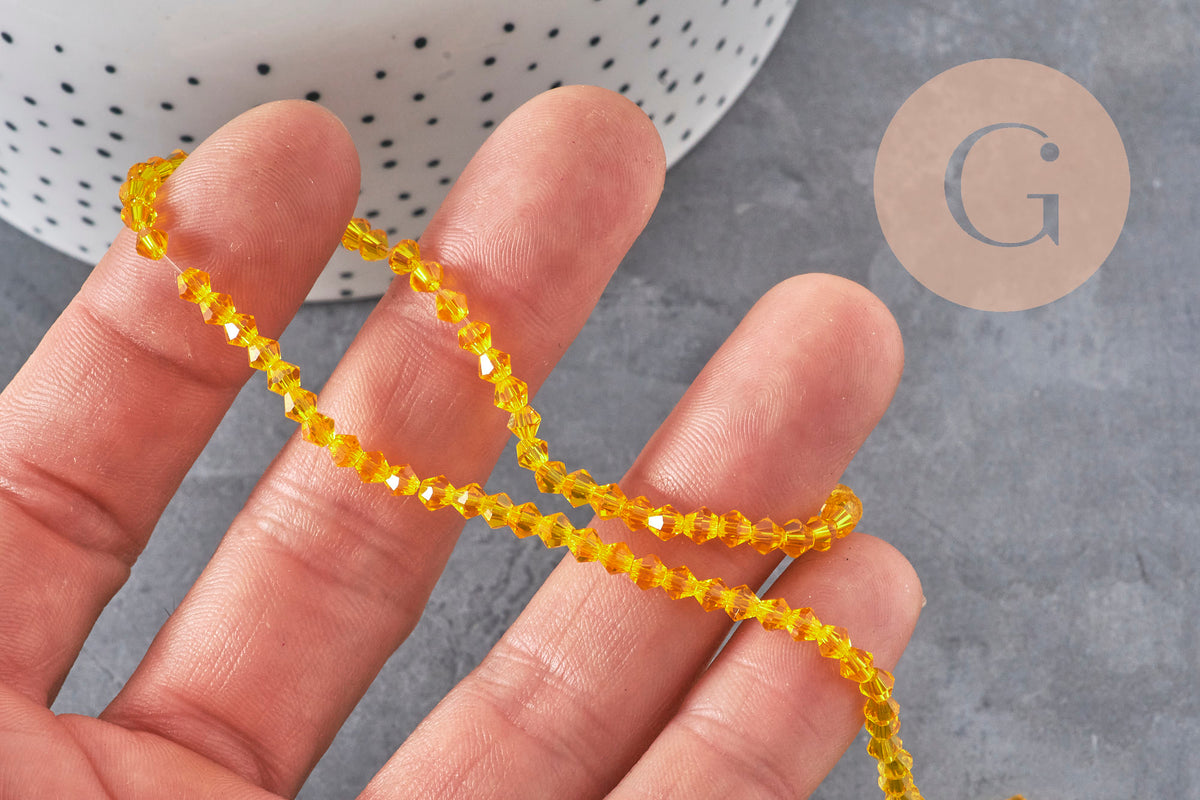 Perles toupies cristal à facette jaune 3.8x3mm, x1 fil de 32.5cm (G11343)-Perles-Gingerlily Perles