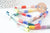 Perles tube porcelaine multicolore 11mm, création bijoux fantaisie DIY, fil de 30cm, x1 G9659