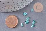 perles rocaille verre rectangle bleu turquoise façon tila, 2mm,2 trous, x50 (1.2 Gr) (G4603)
